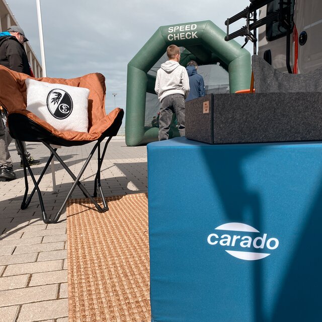 Carado motorhome with outdoor seat and Speed Check tent at the exhibition grounds