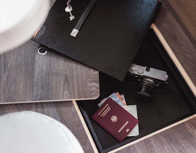 Open floor hatch in the Carado motorhome with storage space for passport, cash, camera and keys