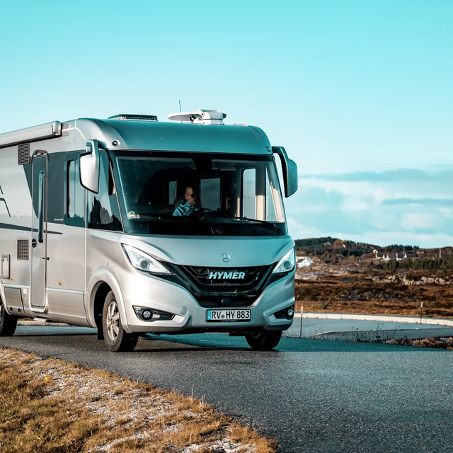 Driving HYMER B-Class MasterLine I in a Scandinavian coastal landscape with sea and blue sky