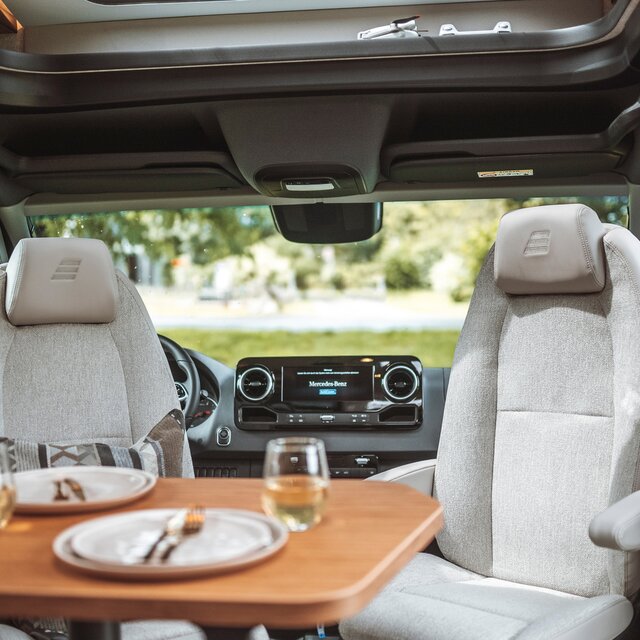 Behind the reversed driver seats in the HYMER ML-T is the Mercedes Benz multimedia system.