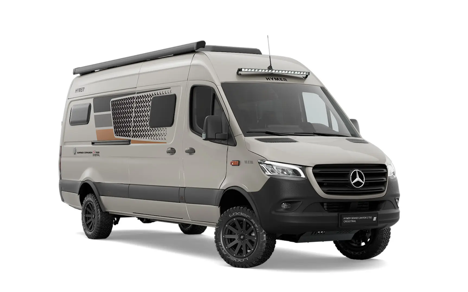 Cut-out of a dark grey campervan, viewed from the front angle on the passenger side of the vehicle.