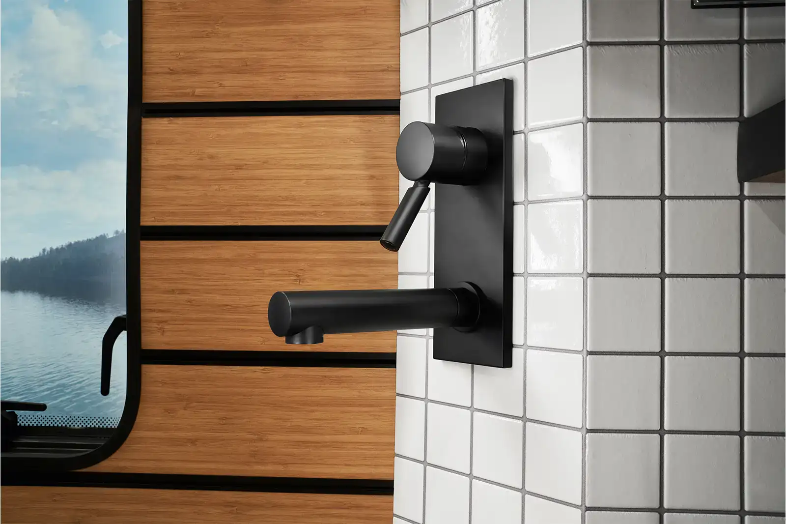 A close-up of the faucet on the tile backsplash of the HYMER Venture S.